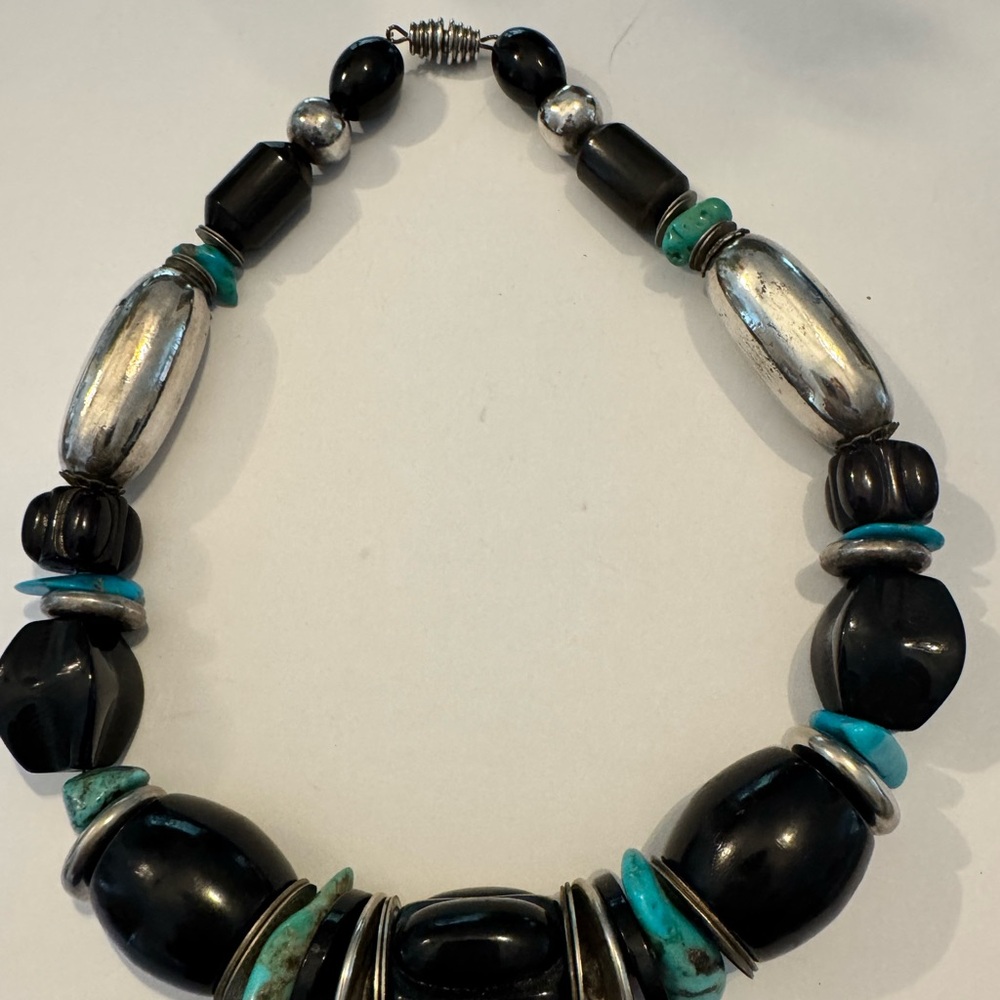 Stunning 17” Silver, turquoise & black bead necklace from Rodeo Drive Boutique.